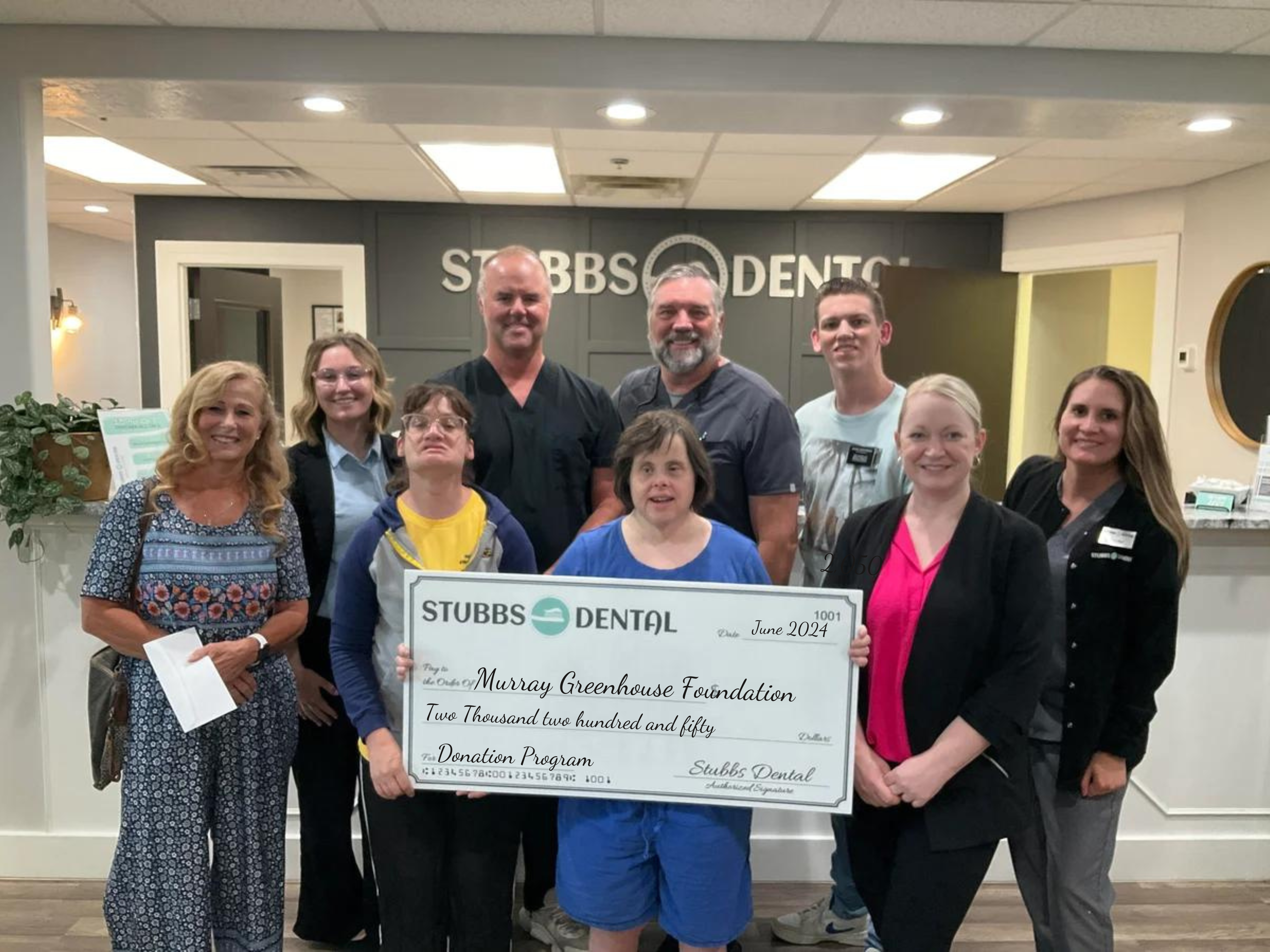 Stubbs Dental presents donation check to Autism Wellness Center of Utah